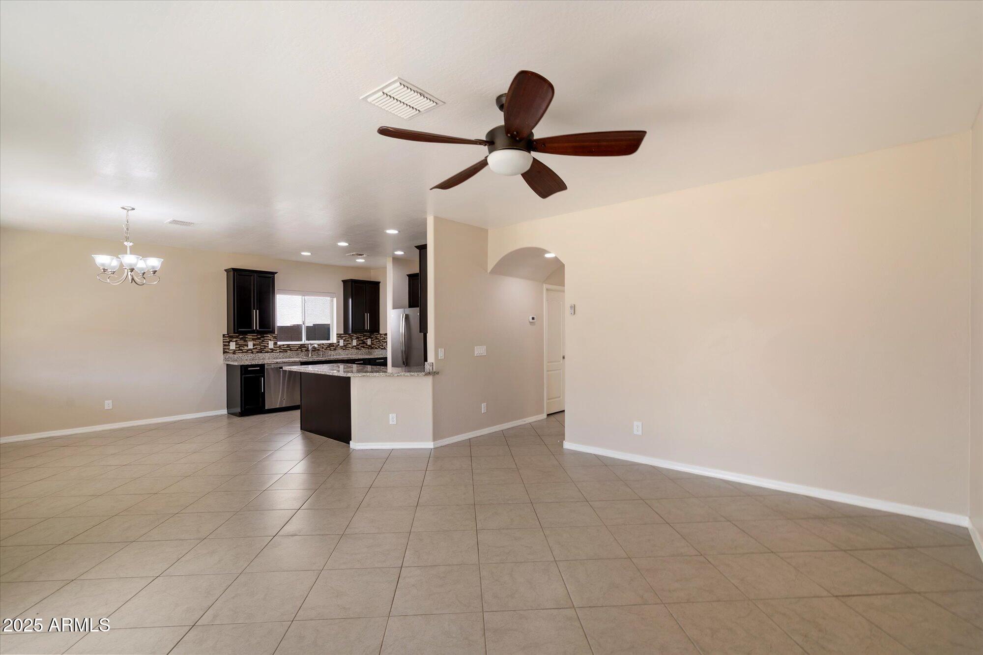 737 East Harwell Road Phoenix, AZ 85042 - Photo 4 of 28 a view of kitchen with refrigerator and microwave
