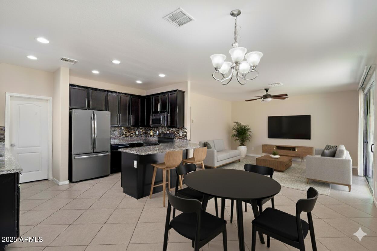 737 East Harwell Road Phoenix, AZ 85042 - Photo 5 of 28 a living room with stainless steel appliances kitchen island granite countertop furniture