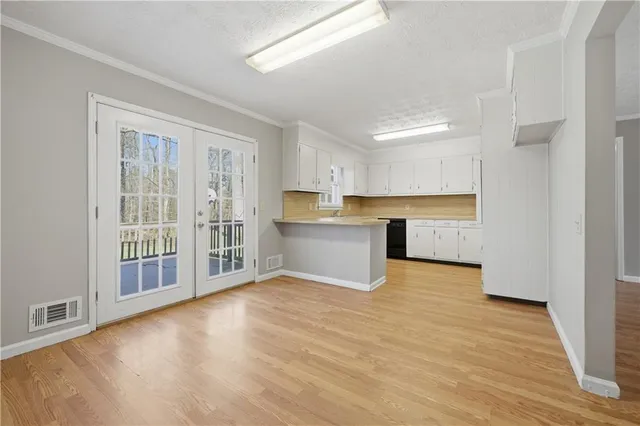 a view of a kitchen with a sink and a window