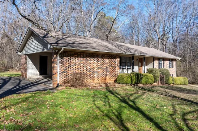 a front view of a house with garden