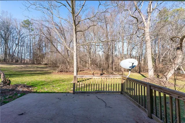 a view of a backyard with trees