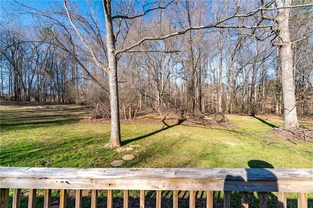 a view of yard along with trees