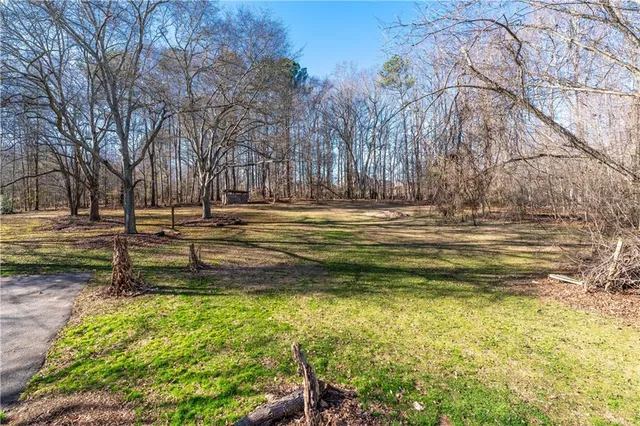 a view of a yard with swimming pool