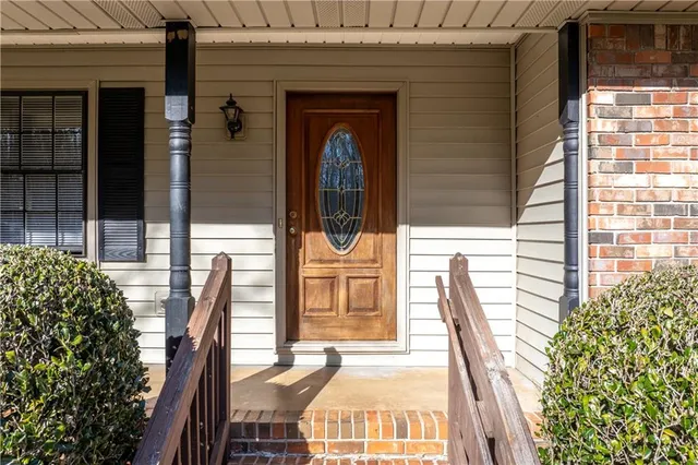 a front view of a house with outdoor seating