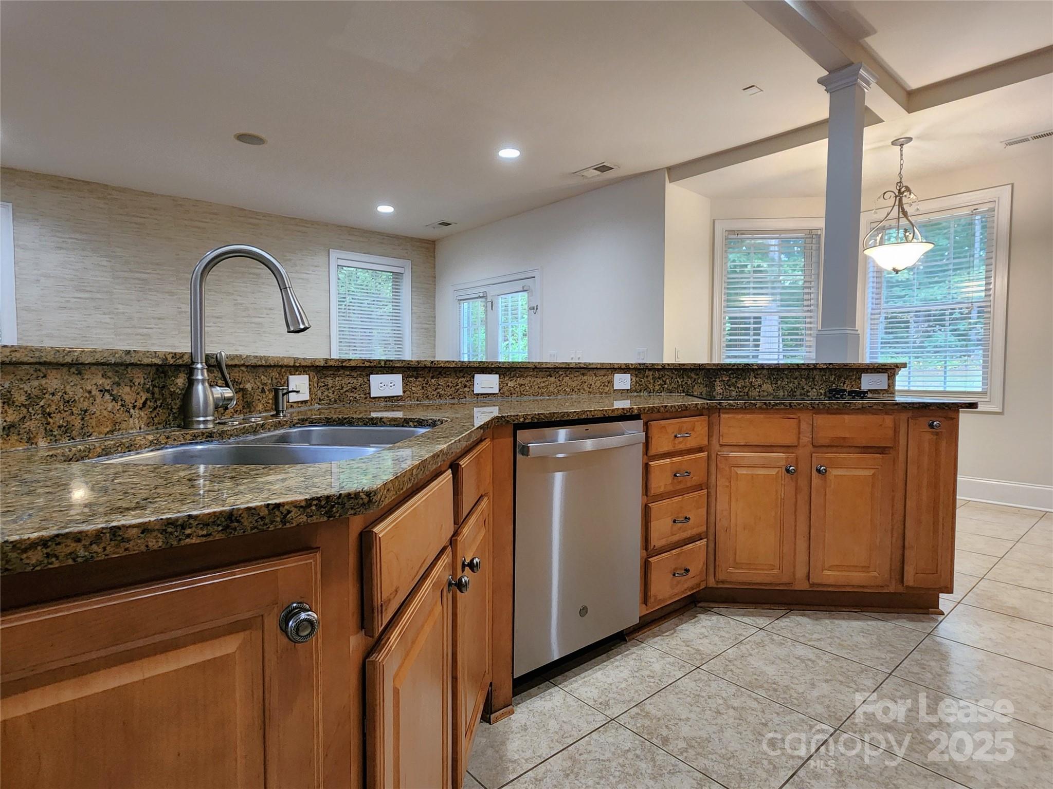 5524 Strabane Drive Matthews, NC 28104 - Photo 13 of 41 a kitchen with granite countertop a sink and cabinets