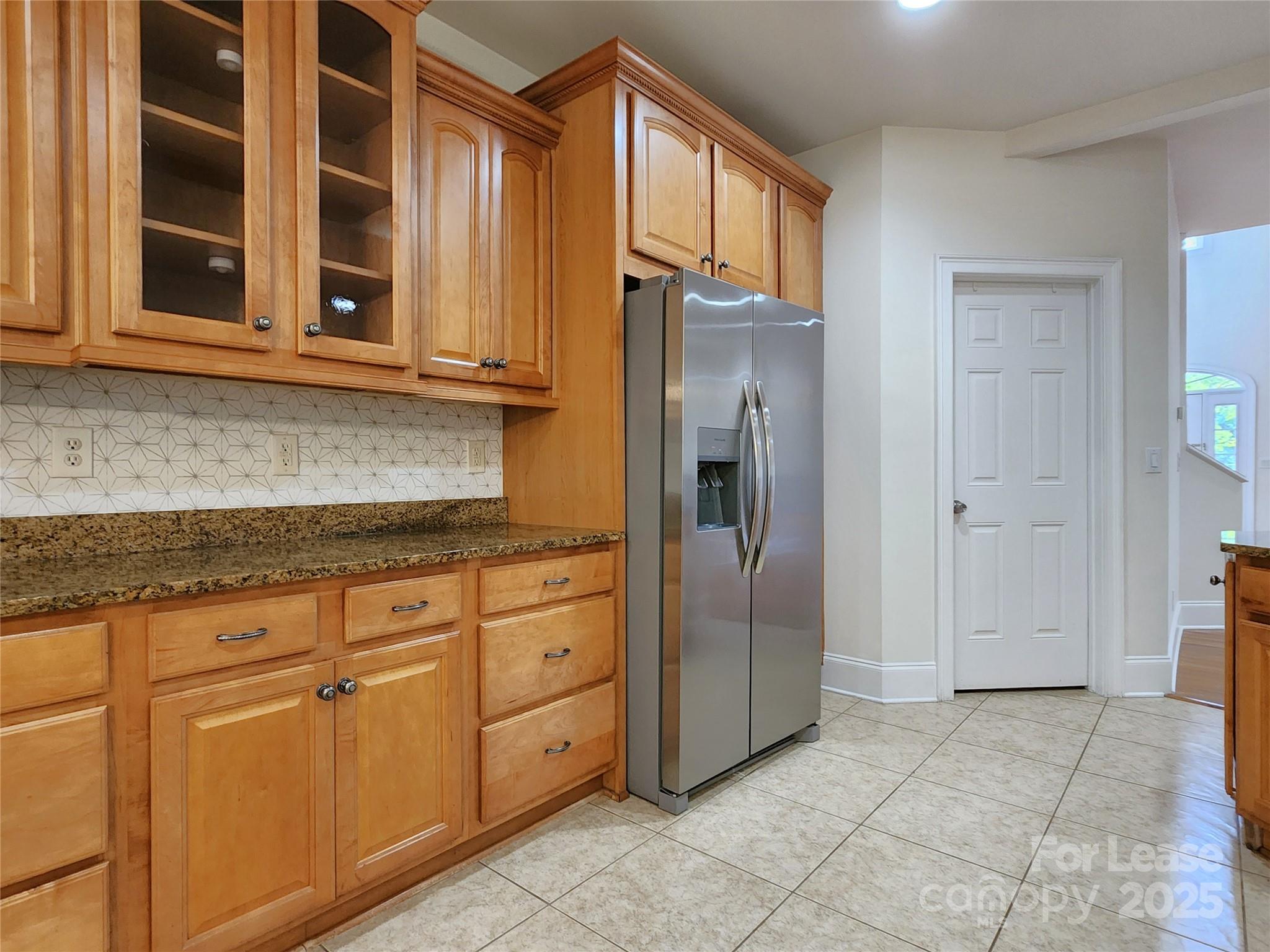 5524 Strabane Drive Matthews, NC 28104 - Photo 14 of 41 a kitchen with stainless steel appliances granite countertop a refrigerator and cabinets