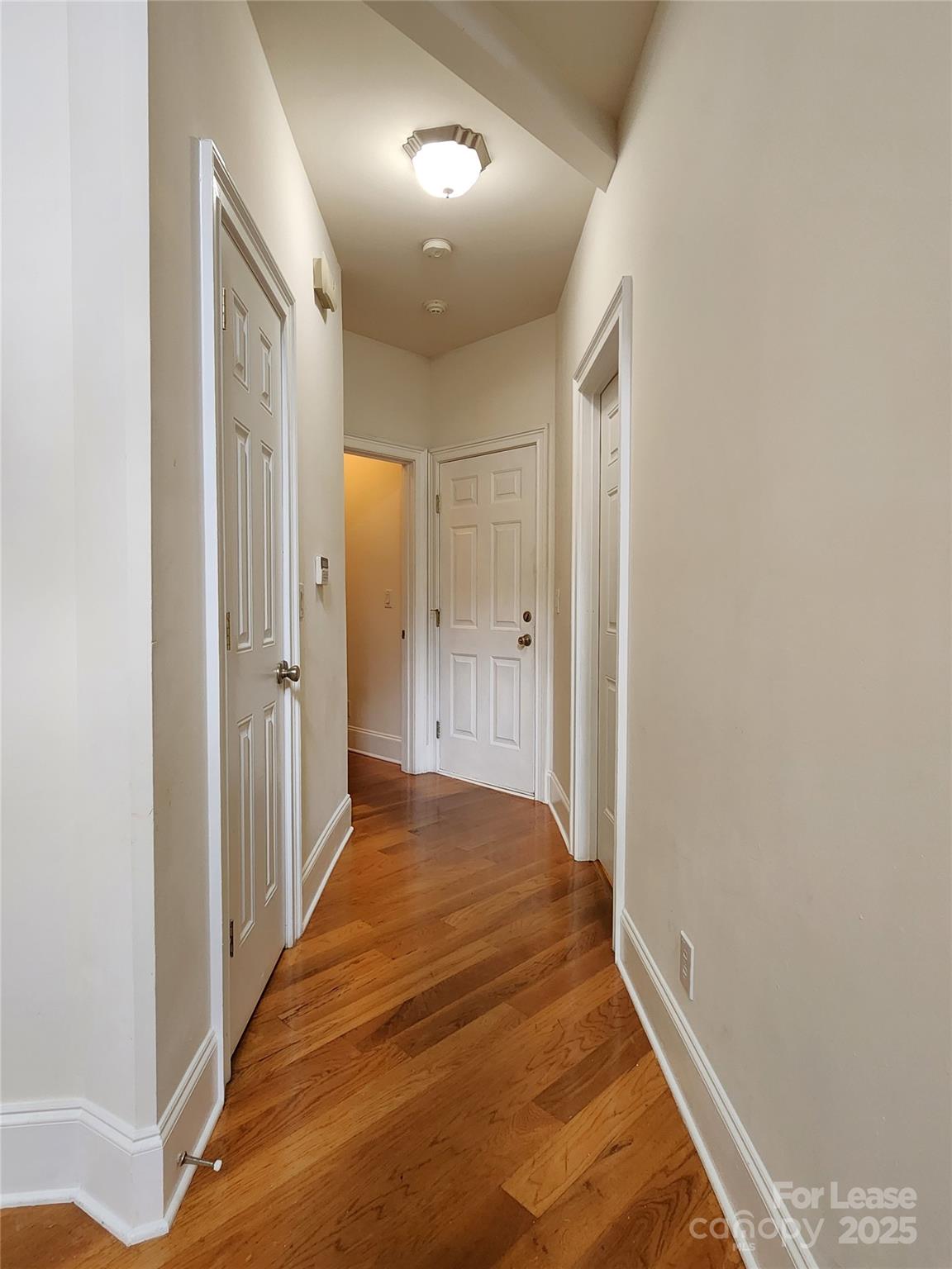 5524 Strabane Drive Matthews, NC 28104 - Photo 15 of 41 a view of a hallway with wooden floor