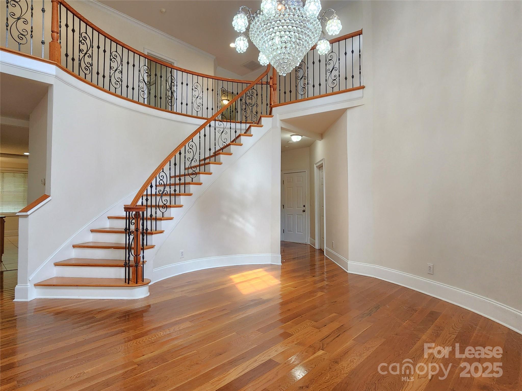5524 Strabane Drive Matthews, NC 28104 - Photo 2 of 41 a view of entryway and hall with wooden floor