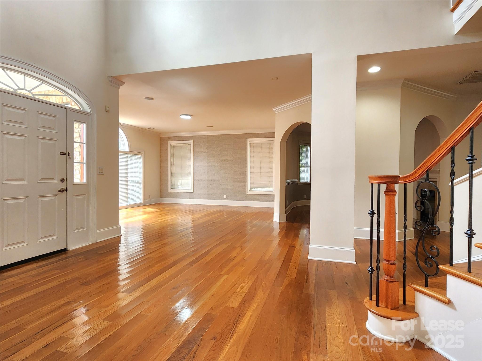 5524 Strabane Drive Matthews, NC 28104 - Photo 3 of 41 a view of a room with wooden floor and stairs