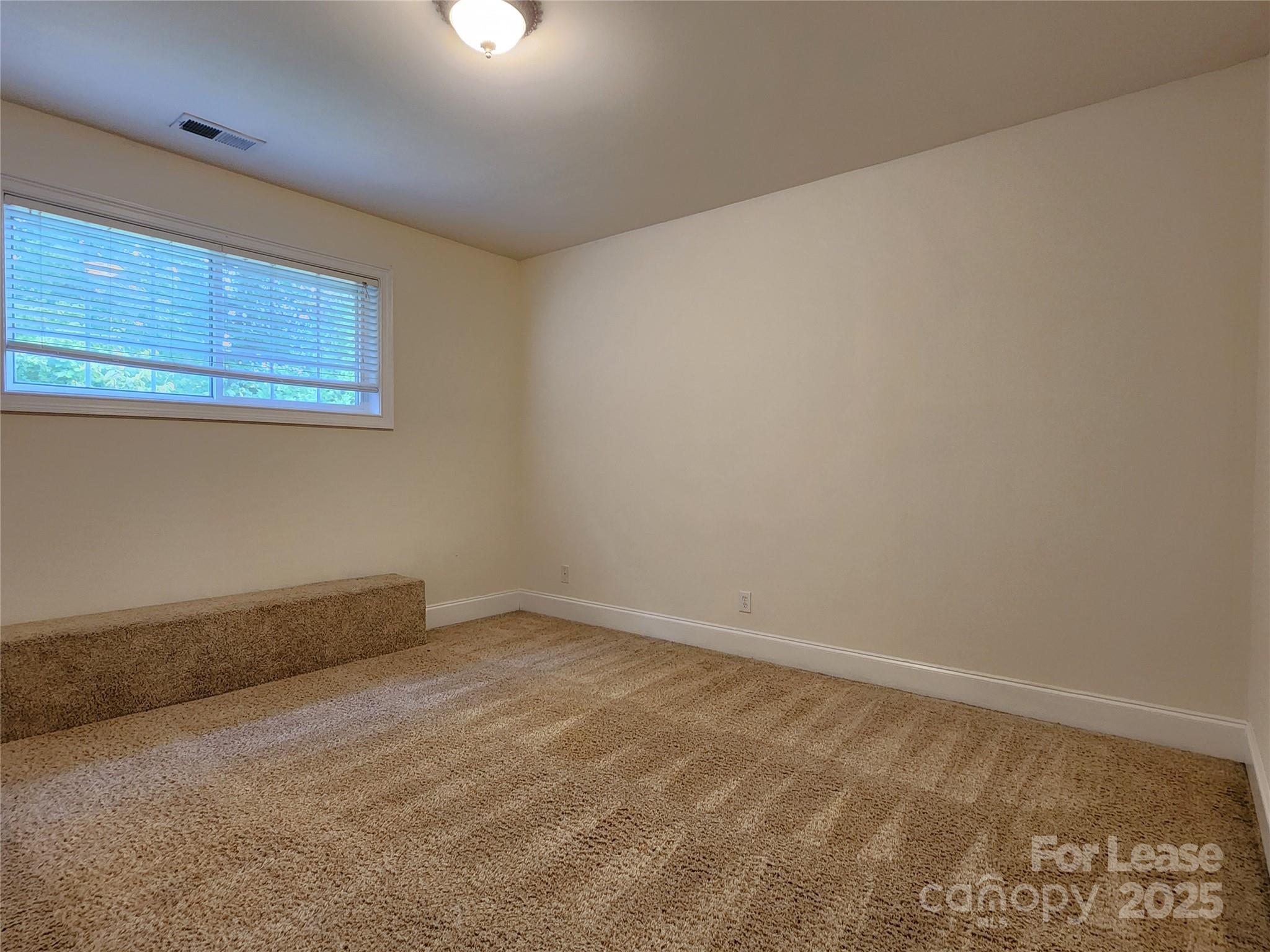 5524 Strabane Drive Matthews, NC 28104 - Photo 32 of 41 an empty room with a workbench