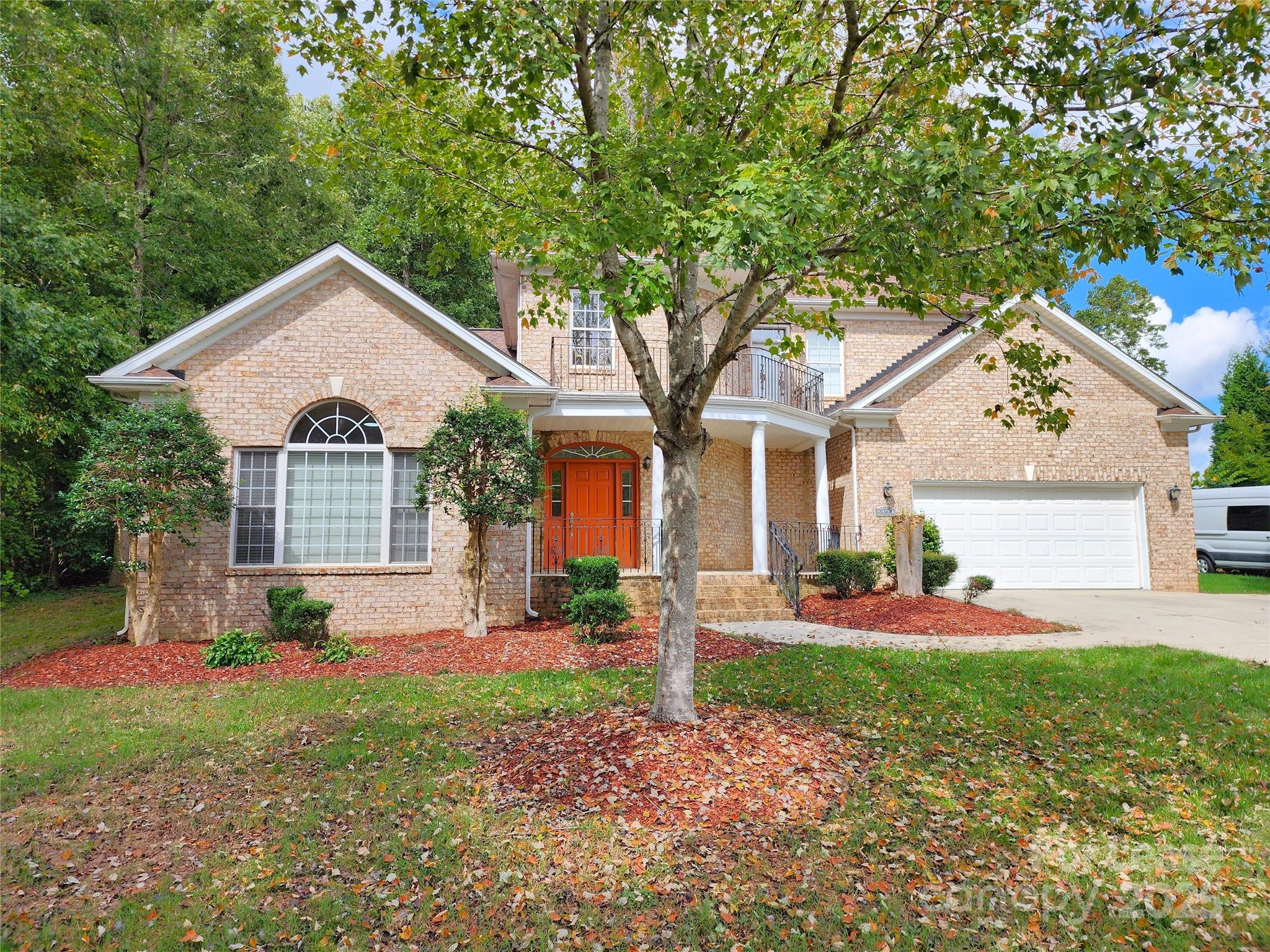5524 Strabane Drive Matthews, NC 28104 - Photo 41 of 41 a front view of a house with a yard and garage
