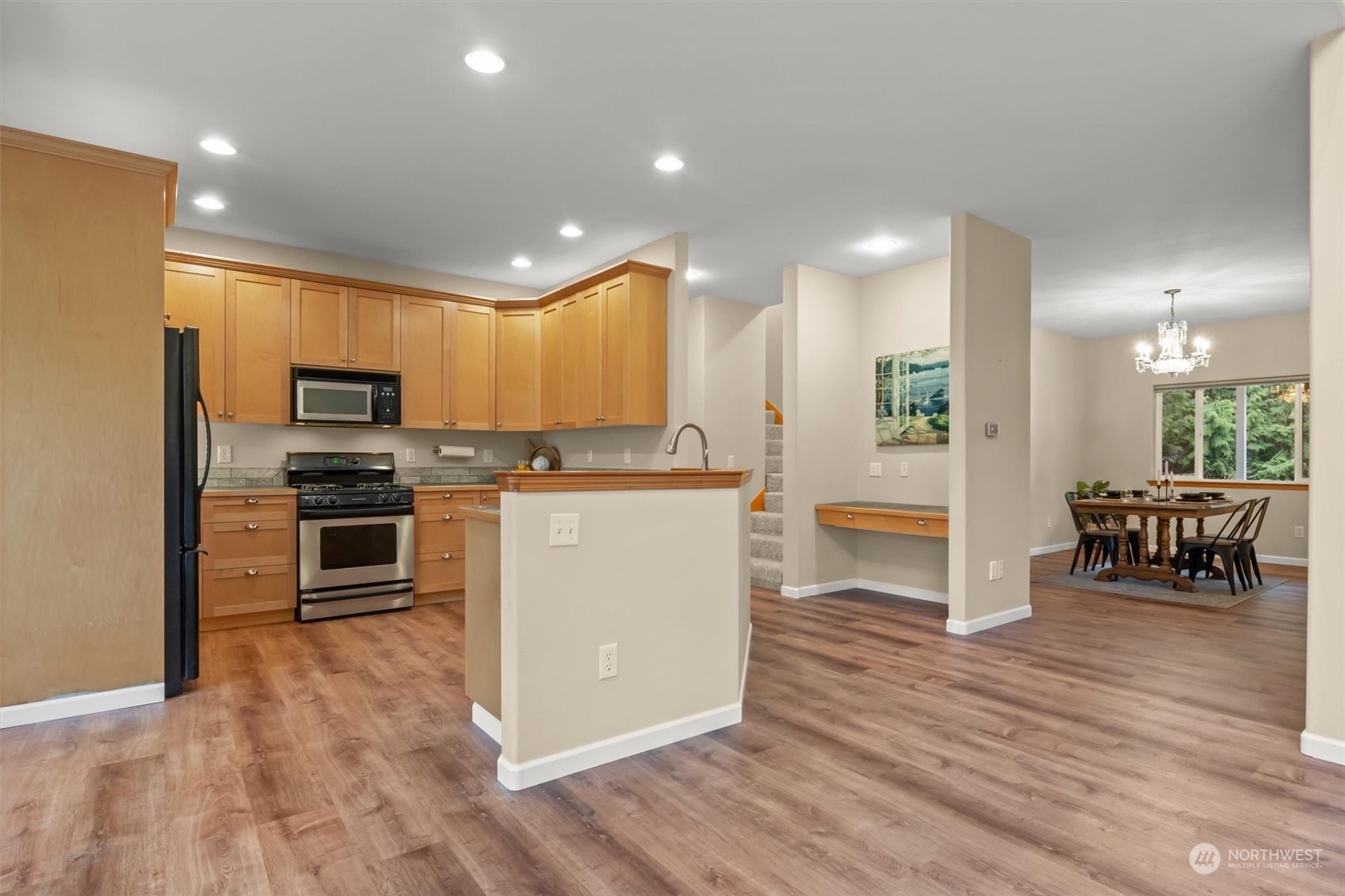 2068 Academy Road Bellingham, WA 98226 - Photo 16 of 40 a kitchen with kitchen island a counter top space a sink stainless steel appliances and cabinets