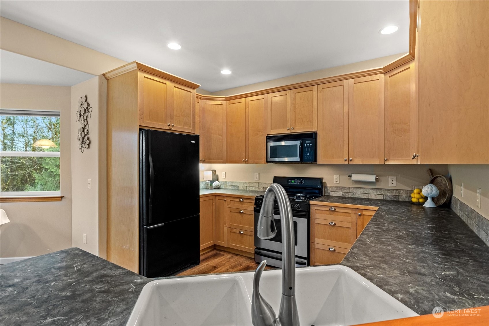 2068 Academy Road Bellingham, WA 98226 - Photo 18 of 40 a kitchen with stainless steel appliances granite countertop a refrigerator stove and sink