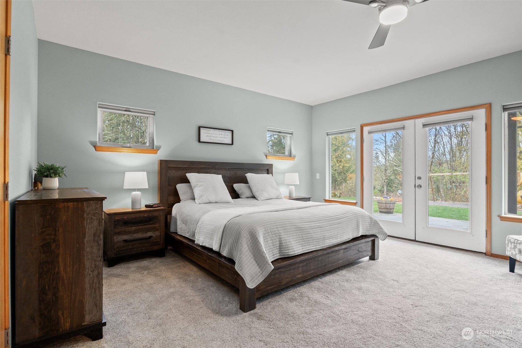 2068 Academy Road Bellingham, WA 98226 - Photo 23 of 40 a spacious bedroom with a bed and wooden floor