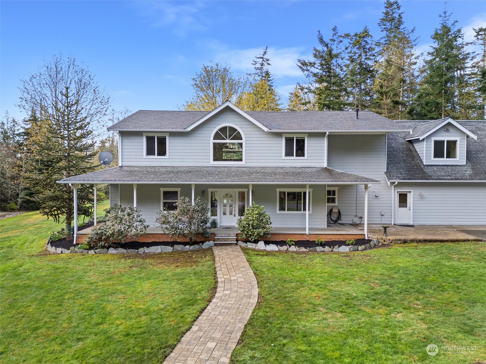2068 Academy Road Bellingham, WA 98226 - Photo 3 of 40 a front view of a house with a yard table and chairs