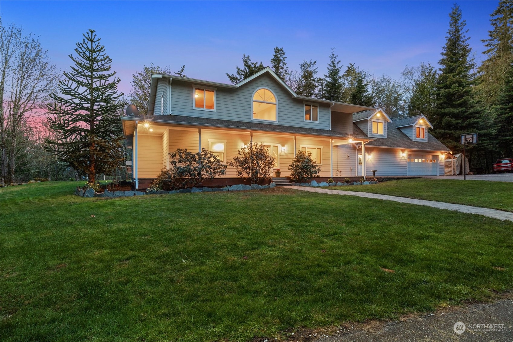 2068 Academy Road Bellingham, WA 98226 - Photo 38 of 40 a front view of a house with a garden and trees