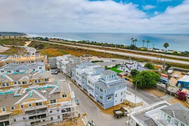 a view of a city with an ocean view