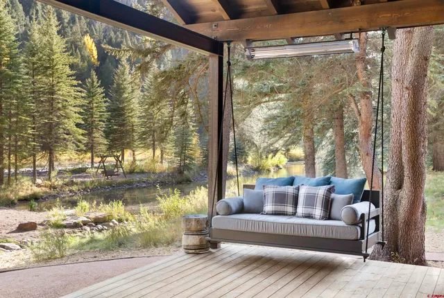 a view of a park with iron fence