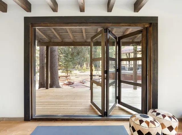 a bedroom with two beds and a window