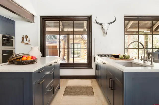 a view of a house with swimming pool and sitting area