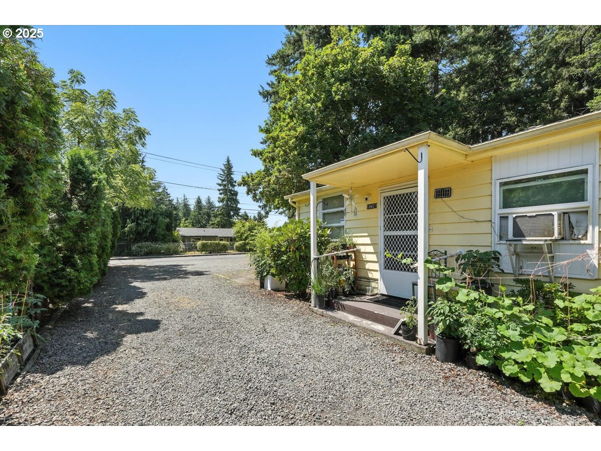 18427 Southeast Yamhill Street Gresham, OR 97233 - Photo 1 of 39 a view of a house with a yard