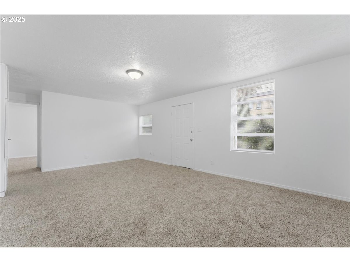 18427 Southeast Yamhill Street Gresham, OR 97233 - Photo 19 of 39 an empty room with windows