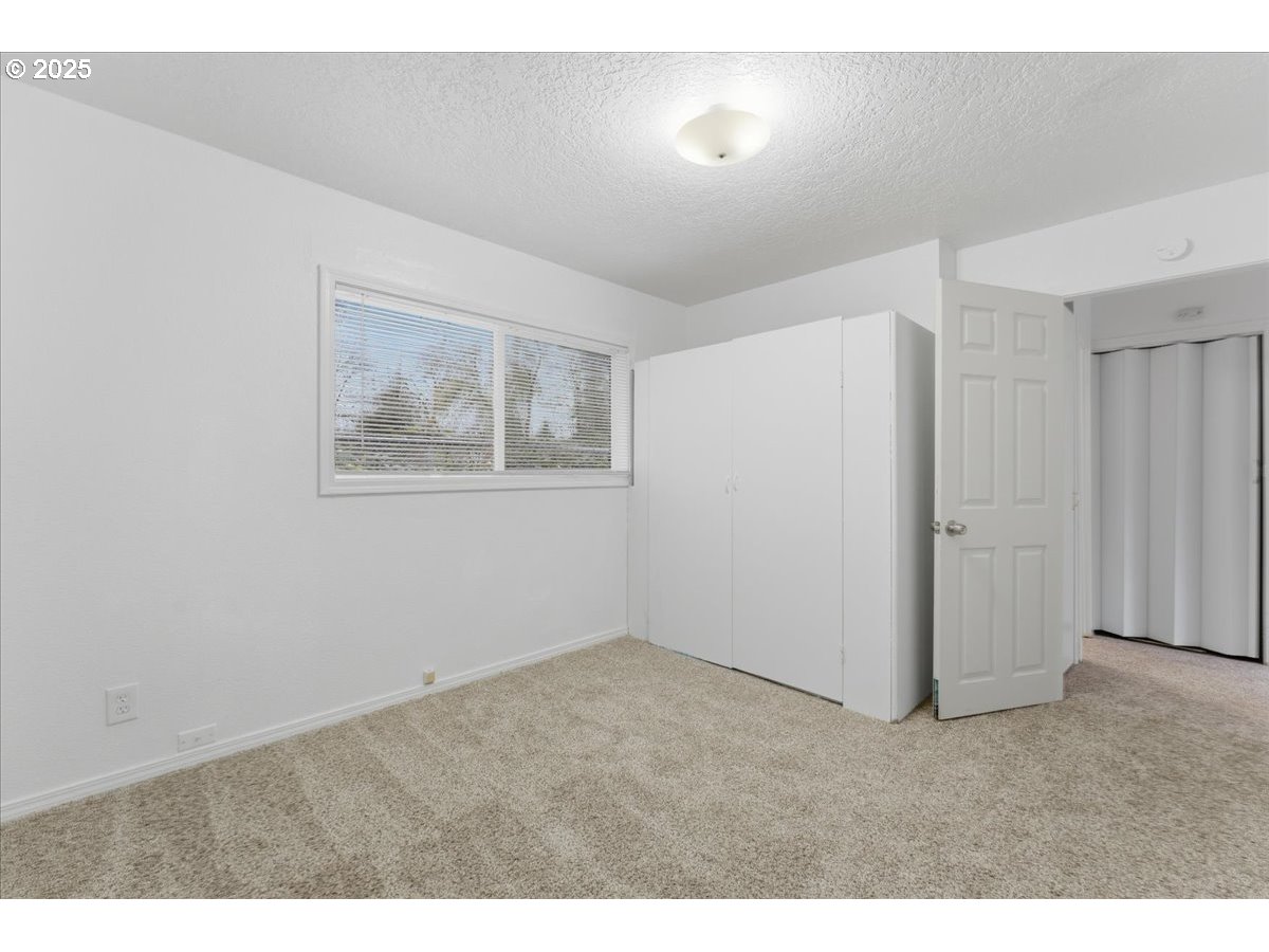 18427 Southeast Yamhill Street Gresham, OR 97233 - Photo 30 of 39 a view of an empty room with a window