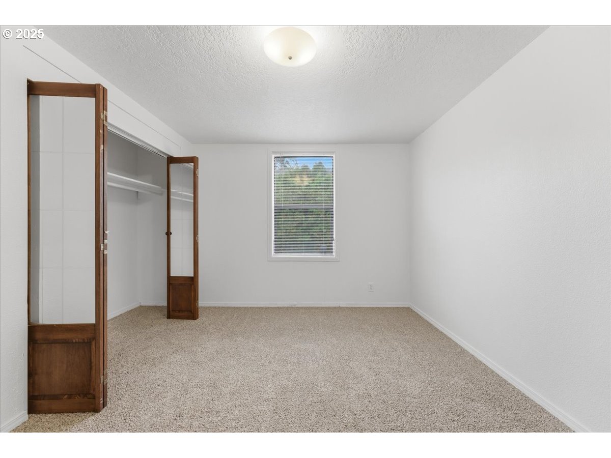 18427 Southeast Yamhill Street Gresham, OR 97233 - Photo 31 of 39 a view of an empty room with a window