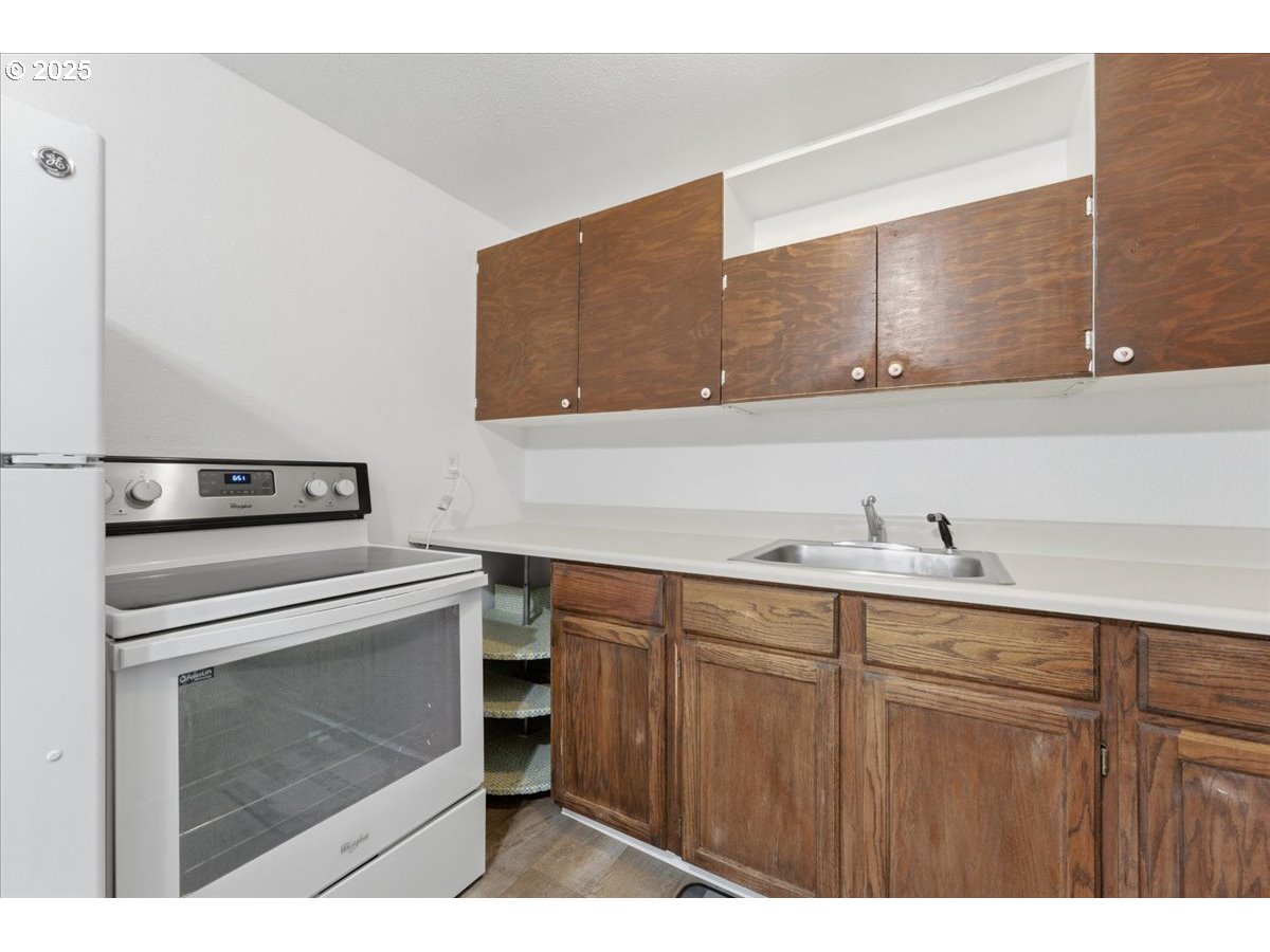 18427 Southeast Yamhill Street Gresham, OR 97233 - Photo 32 of 39 a kitchen with a sink and cabinets