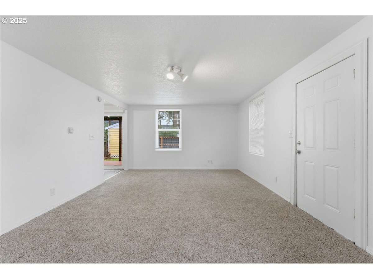 18427 Southeast Yamhill Street Gresham, OR 97233 - Photo 35 of 39 a view of an empty room with a window