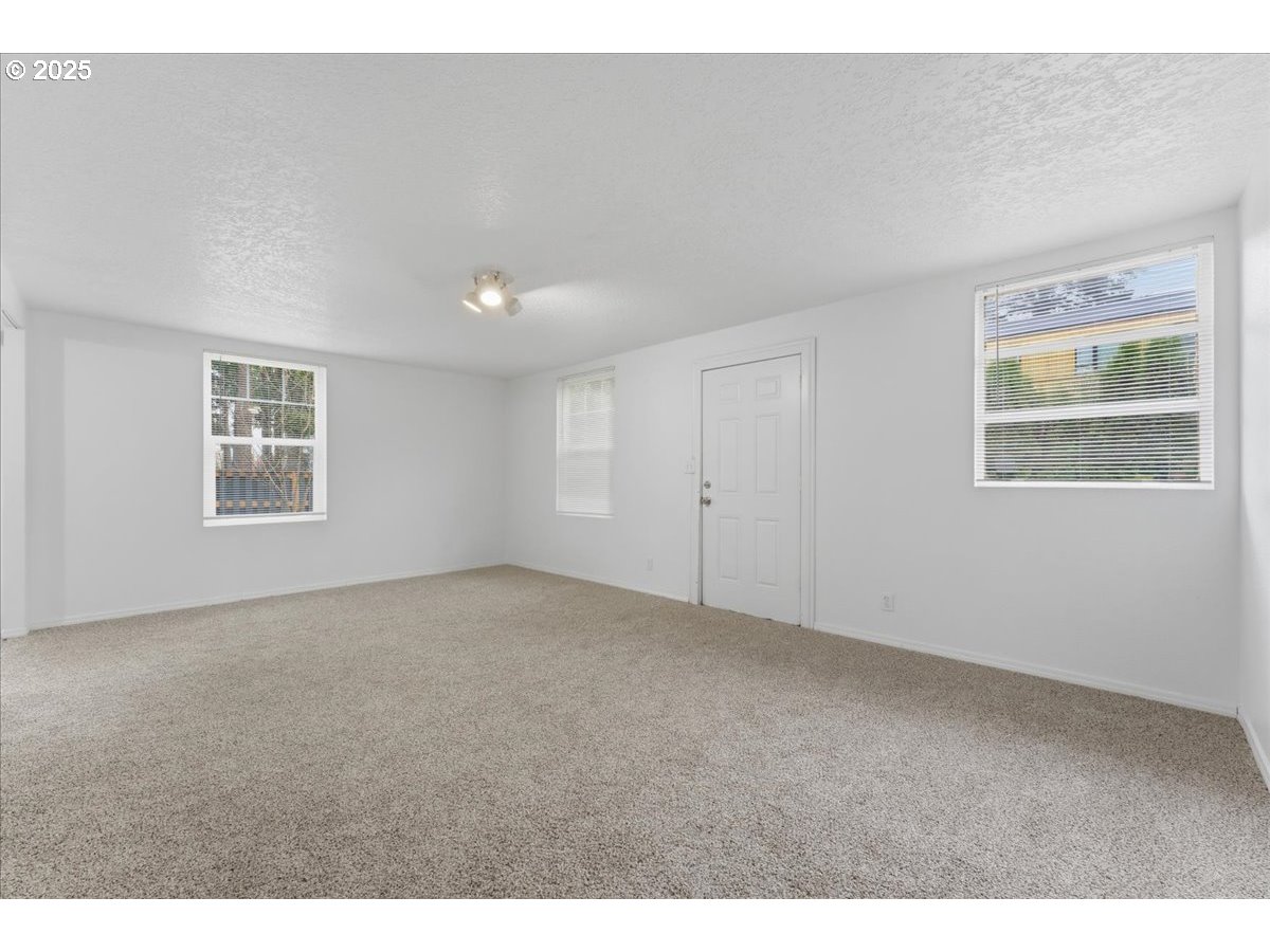 18427 Southeast Yamhill Street Gresham, OR 97233 - Photo 37 of 39 a view of an empty room with a window