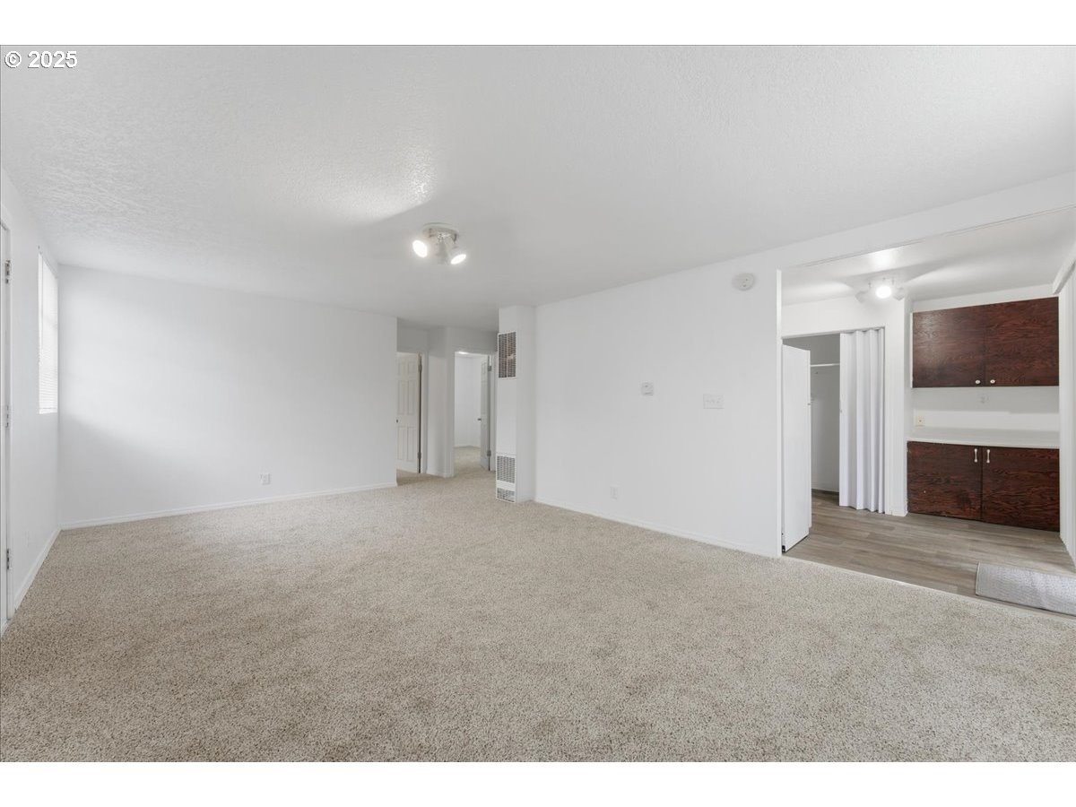 18427 Southeast Yamhill Street Gresham, OR 97233 - Photo 38 of 39 a view of an empty room with a kitchen
