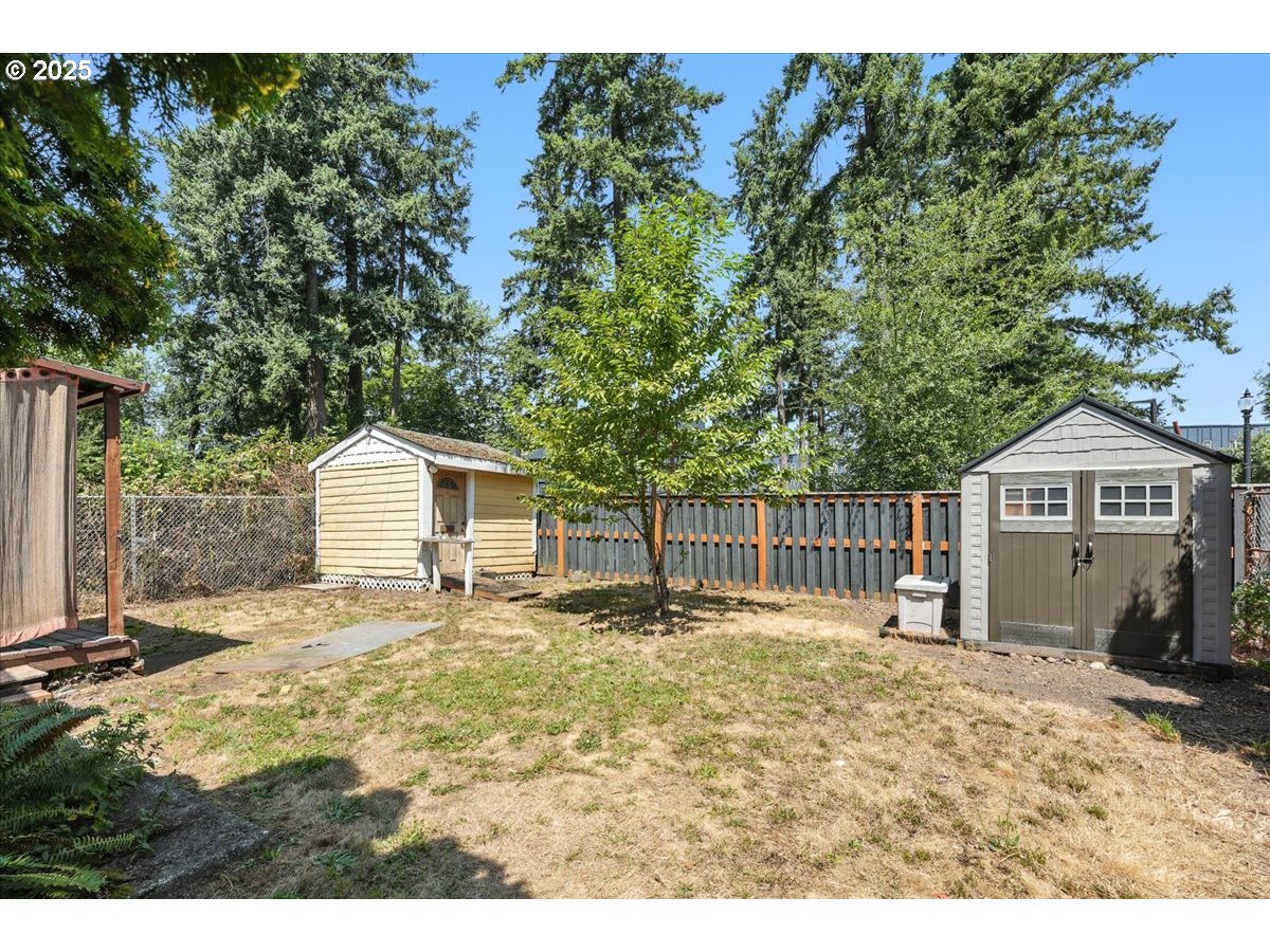 18427 Southeast Yamhill Street Gresham, OR 97233 - Photo 8 of 39 a front view of a house with a yard