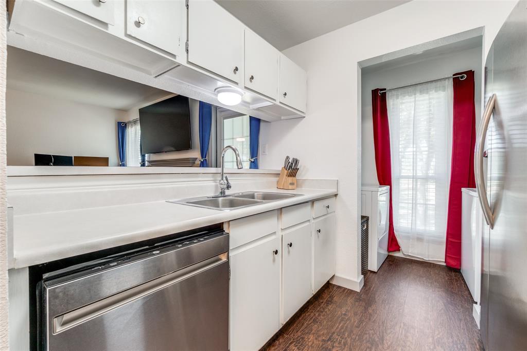 5981 Arapaho Road, Unit 1603 Dallas, TX 75248 - Photo 14 of 25 a kitchen with stainless steel appliances a sink stove and cabinets