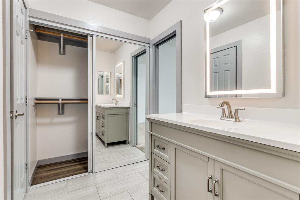 5981 Arapaho Road, Unit 1603 Dallas, TX 75248 - Photo 19 of 25 a bathroom with a sink and a mirror