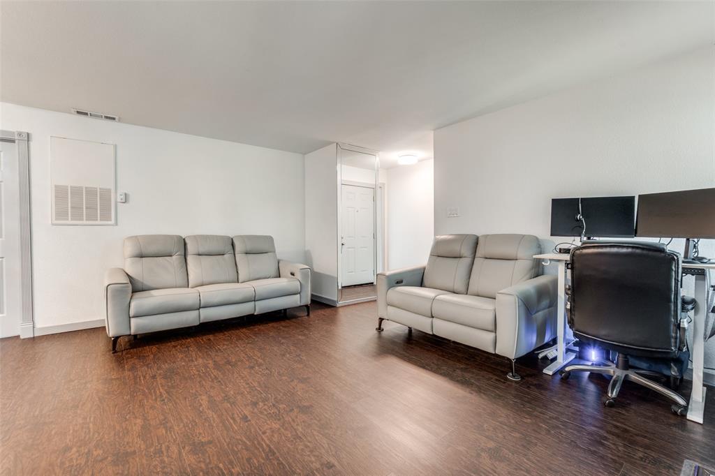 5981 Arapaho Road, Unit 1603 Dallas, TX 75248 - Photo 2 of 25 a living room with furniture and a flat screen tv