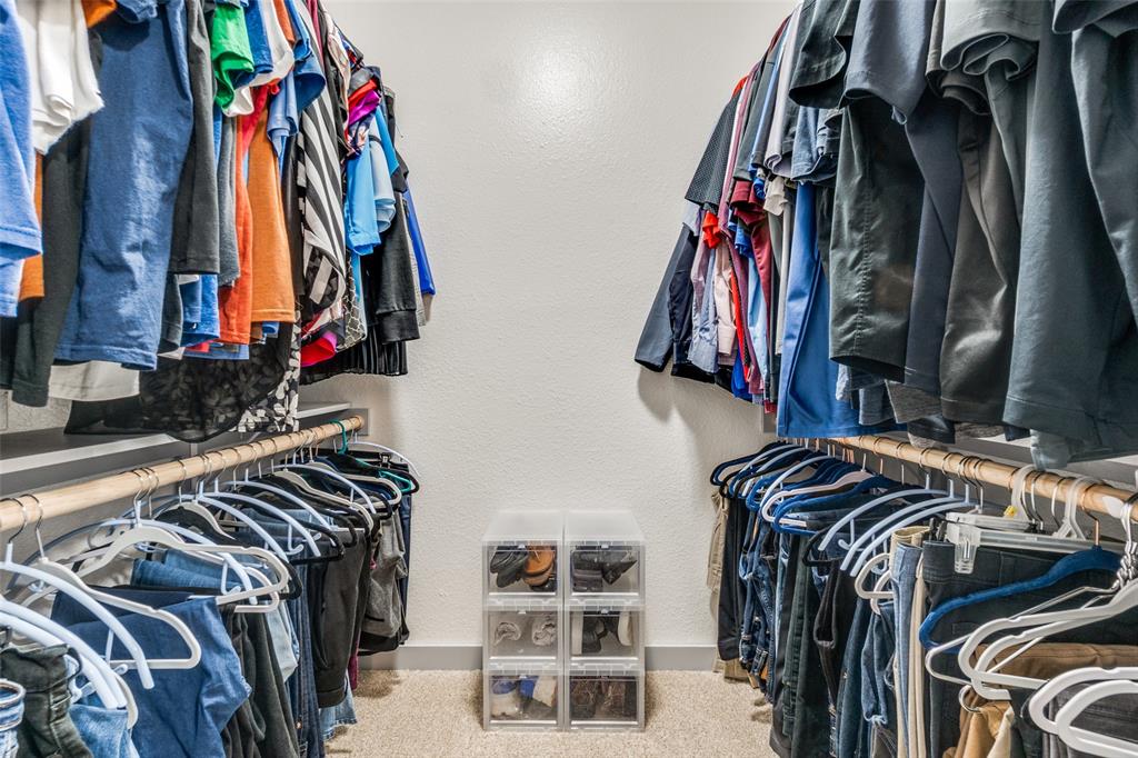 5981 Arapaho Road, Unit 1603 Dallas, TX 75248 - Photo 21 of 25 a view of walk in closet with clothes and shoes
