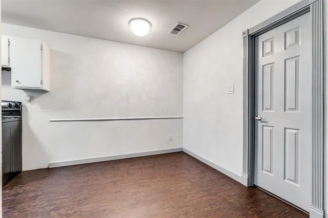 an empty room with cabinet