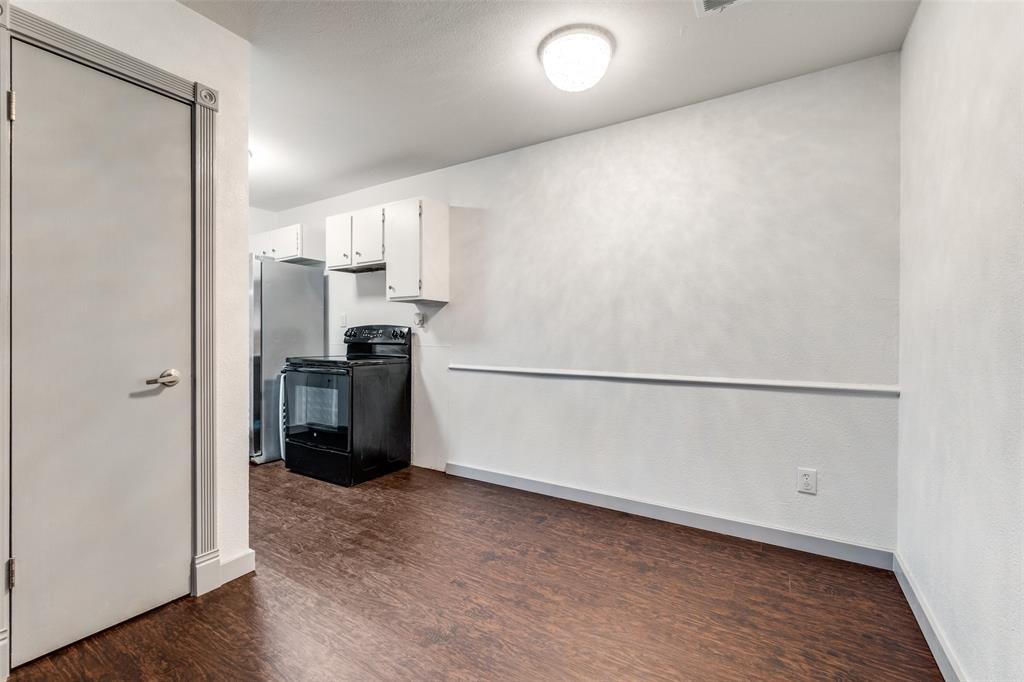 5981 Arapaho Road, Unit 1603 Dallas, TX 75248 - Photo 10 of 25 a view of a kitchen with a refrigerator a stove top oven