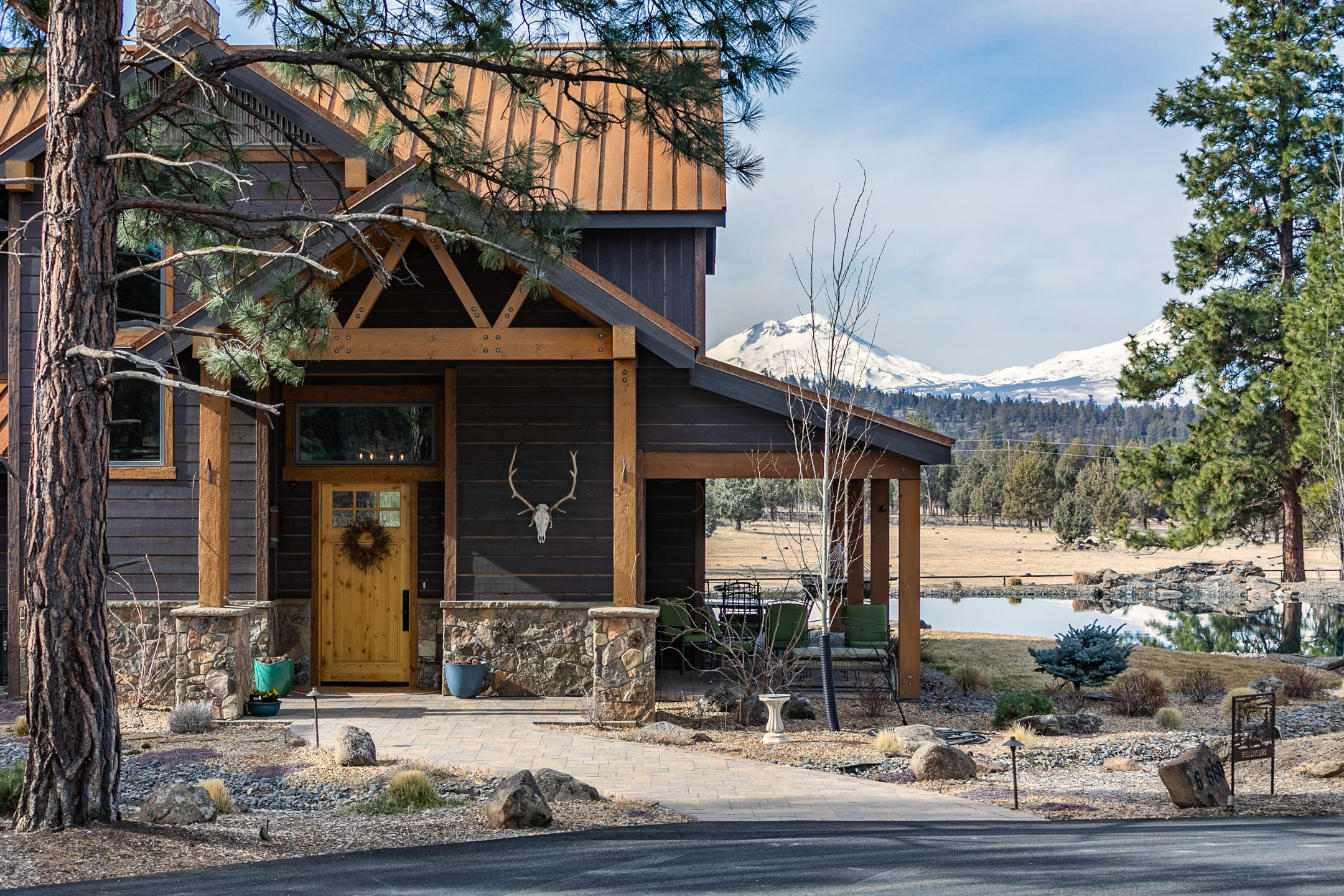 69580 Goodrich Road Sisters, OR 97759 - Photo 9 of 38 Welcoming cover front porch entry