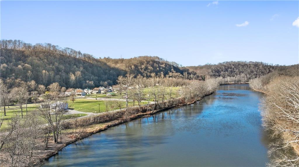 429 River Road Perryopolis, PA 15473 - Photo 8 of 14 a view of a lake with mountains in the background