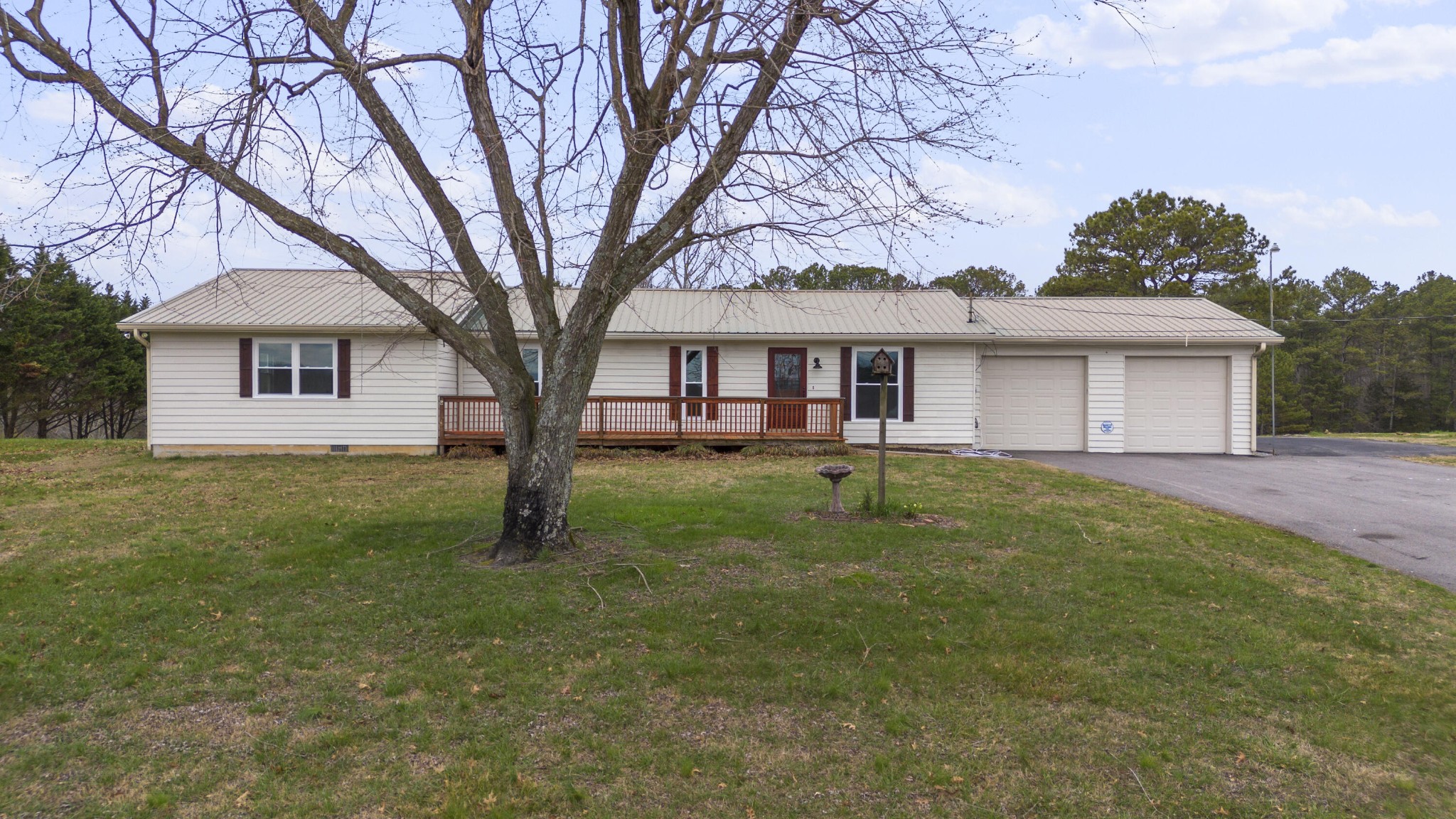 856 Cedar Springs Road Southeast Cleveland, TN 37323 - Photo 1 of 39 a view of a yard in front of a house with large trees
