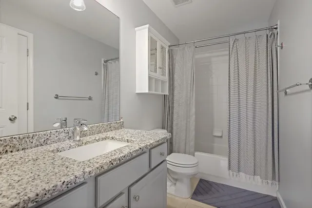 a view of a workspace with wooden floor