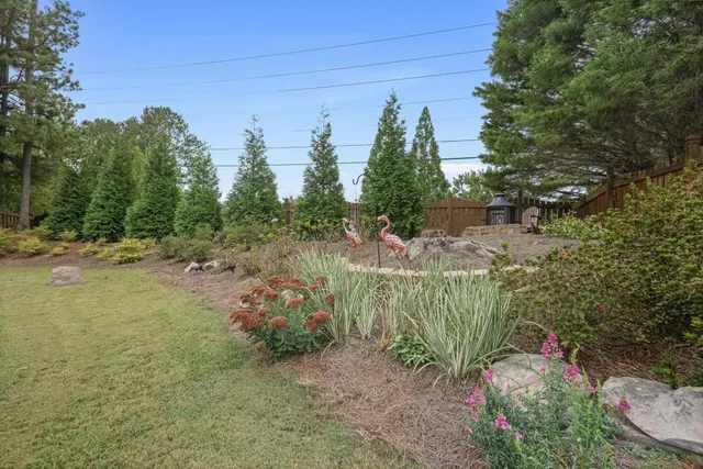 an aerial view of a house with a yard table and chairs