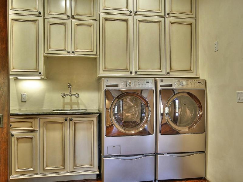219 Conejo Road Santa Barbara, CA 93103 - Photo 15 of 24 a close view of a sink and washer in a kitchen
