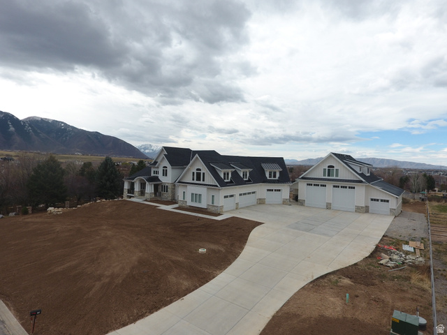 1354 South 800 East Mapleton, UT 84664 - Photo 111 of 129 View of front facade with a mountain view, concrete driveway, and stone siding