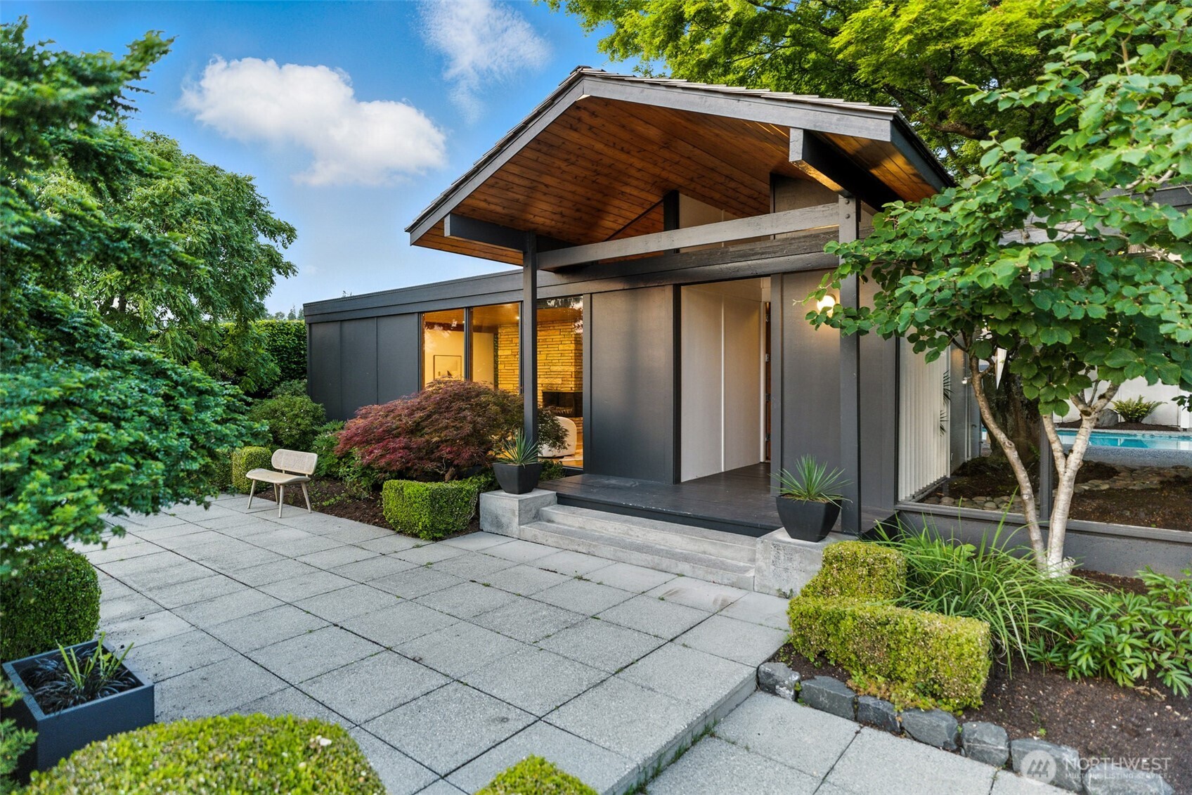 a front view of a house with garden