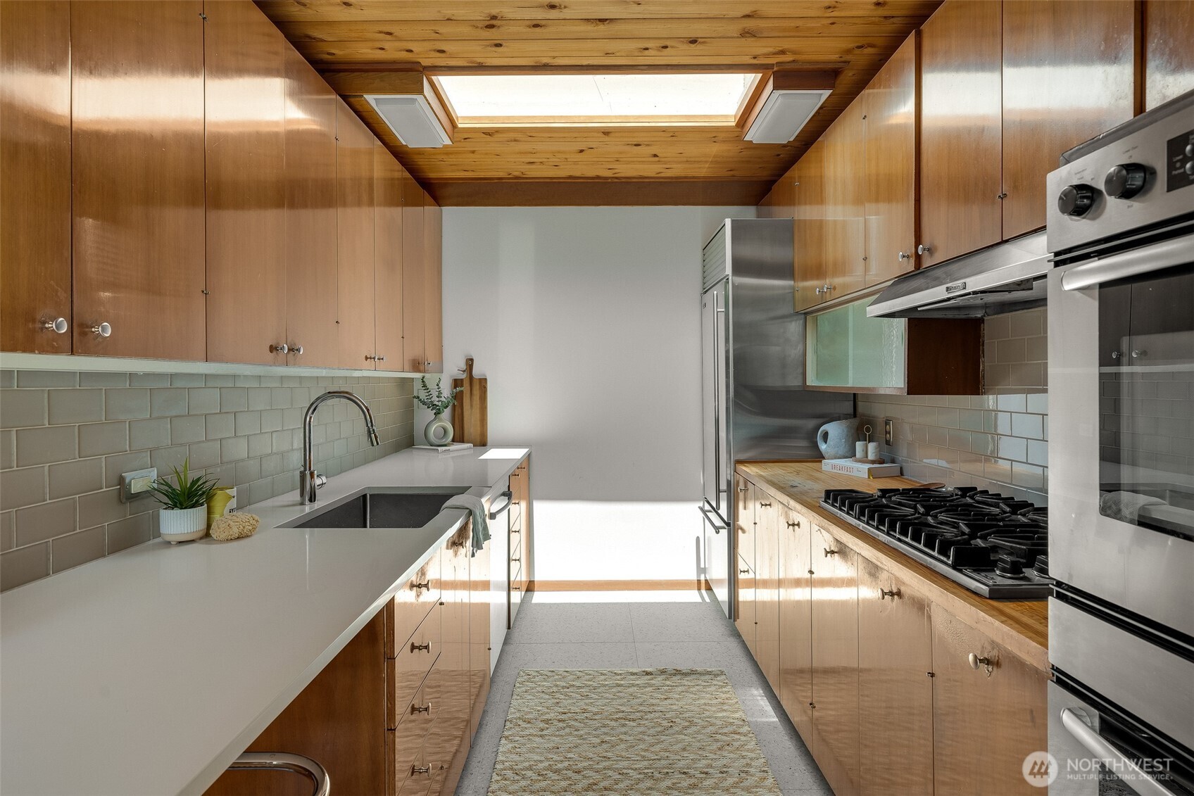 615 Bayside Road Bellingham, WA 98225 - Photo 13 of 31 a kitchen with stainless steel appliances granite countertop a sink stove and cabinets