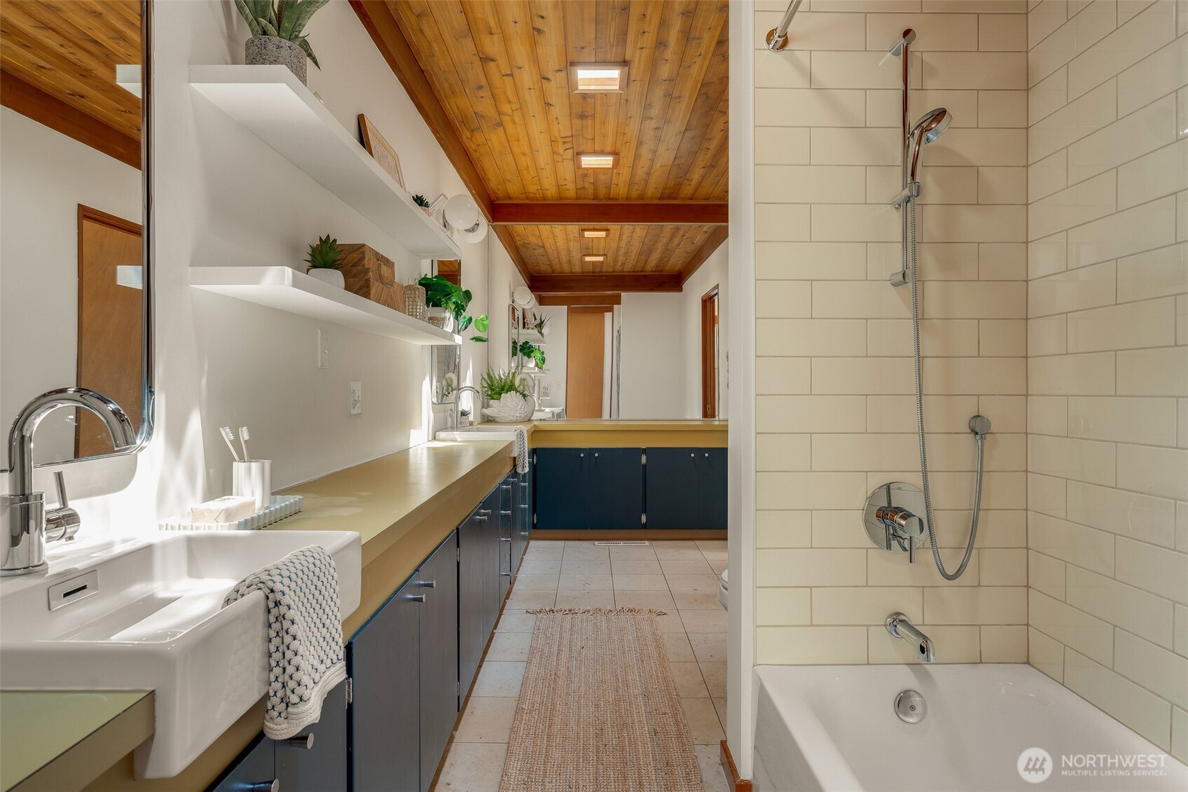 615 Bayside Road Bellingham, WA 98225 - Photo 18 of 31 a bathroom with a tub sink and mirror