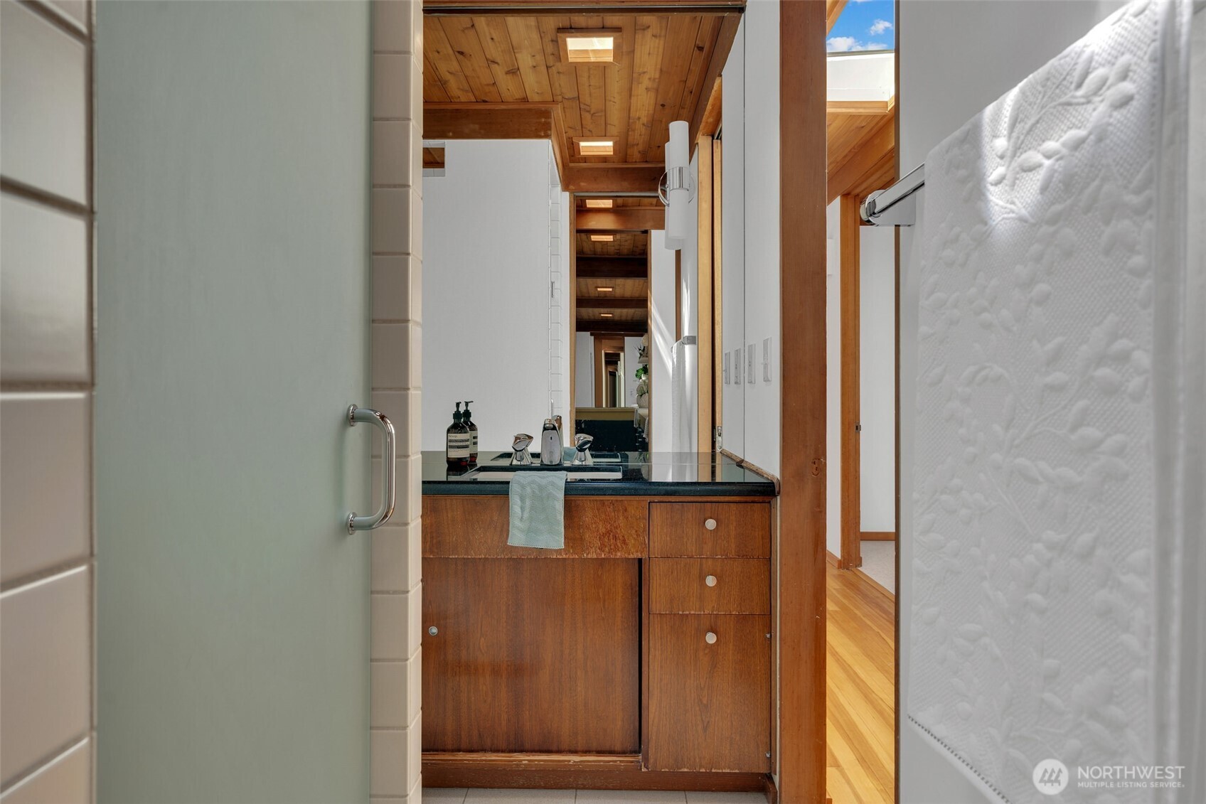 615 Bayside Road Bellingham, WA 98225 - Photo 20 of 31 a bathroom with a granite countertop sink and a mirror